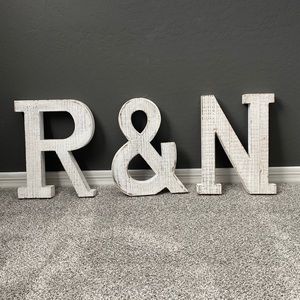 Wood letters for wedding. R & N. White distressed. Each ~14” tall and 10” wide.